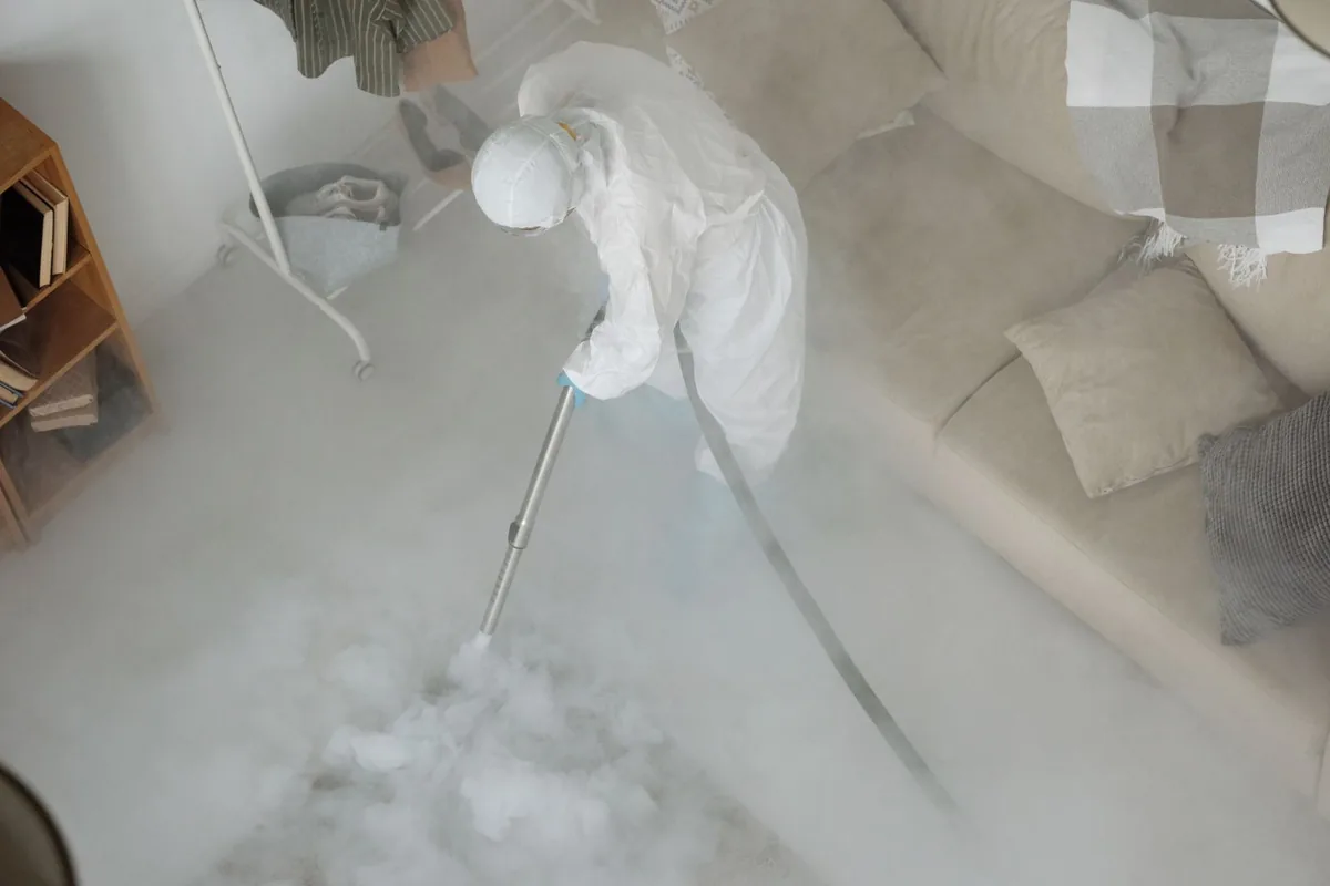 Biohazard cleanup technician in protective equipment, Continental, OH